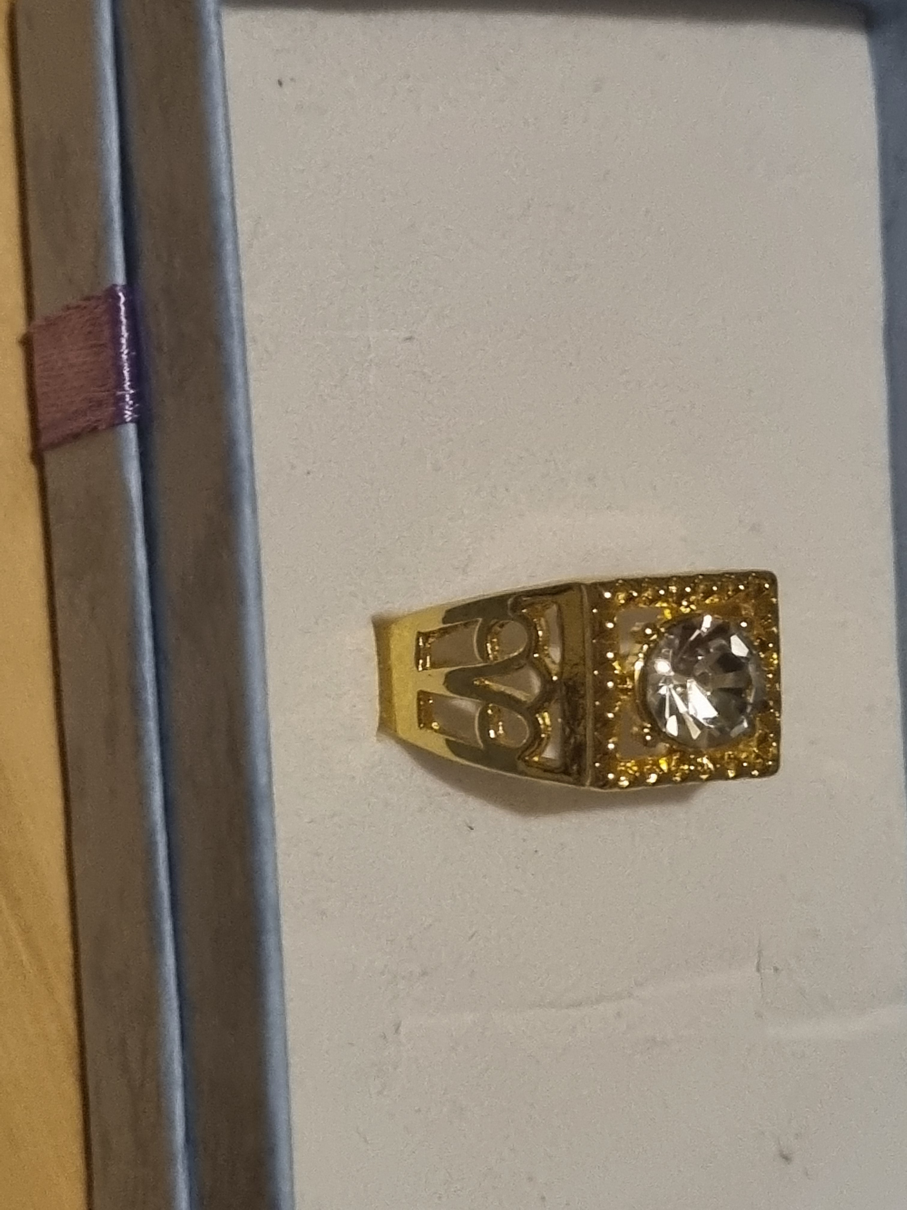 Mens stainless steel golden ring with beautifully designed setting.