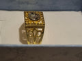 Mens stainless steel golden ring with beautifully designed setting.