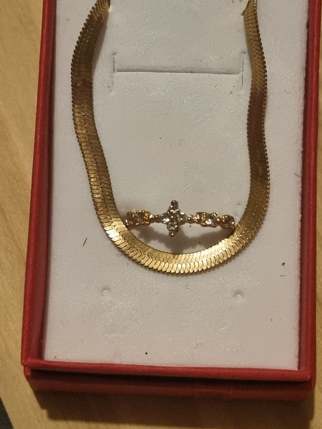 Beautifully designed ladies golden braclet and ring set.