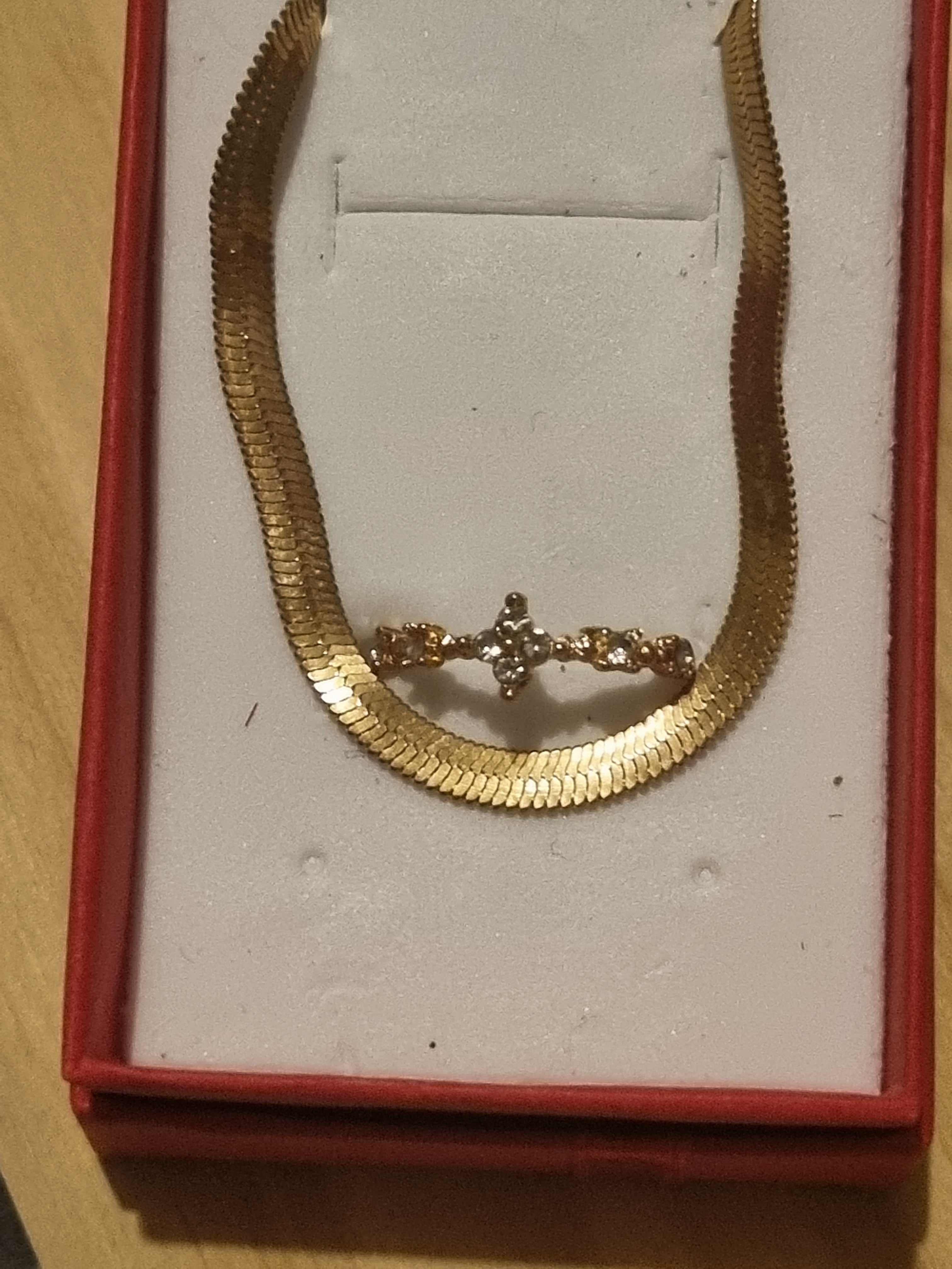 Beautifully designed ladies golden braclet and ring set.