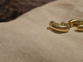 Gold coloured earrings