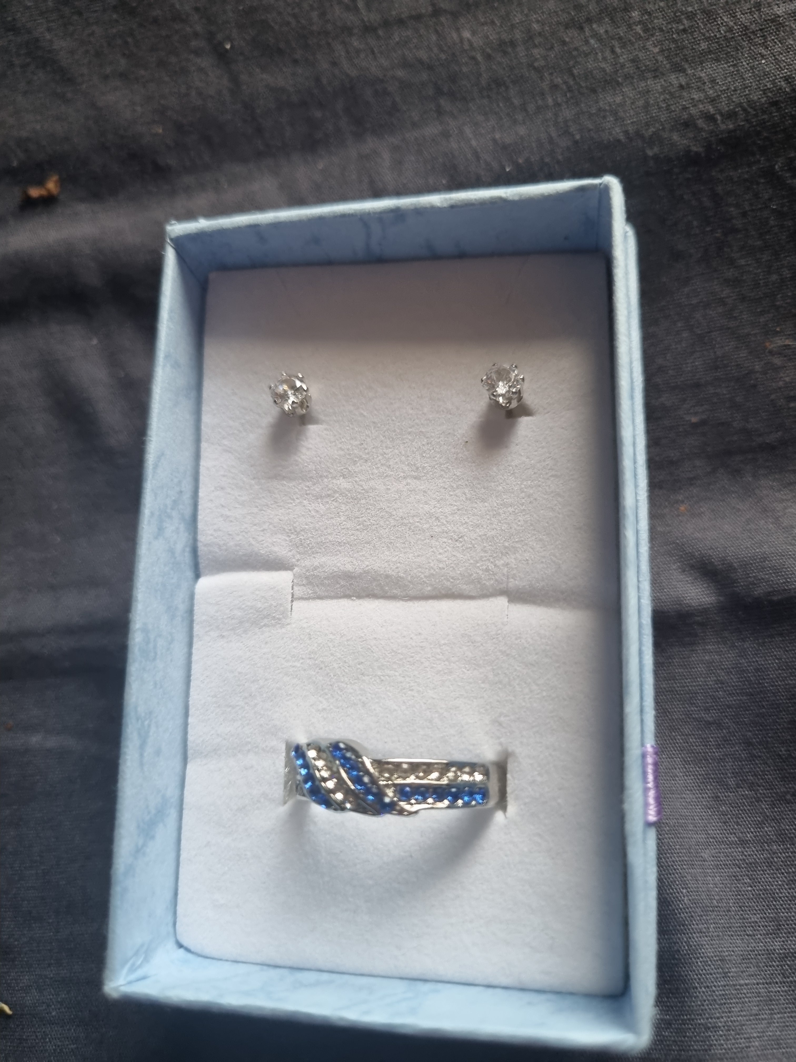 Rhinestone earrings and beautiful silver ladies set beautiful blue and diamond look gems.
